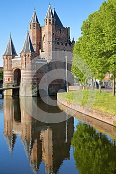 Reflections of the Amsterdamse Poort city gate built between 1400 and 1500 in Haarlem