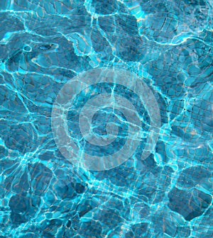 Reflections on blue pool water background