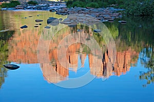 Reflections of Cathedral Rock on Oak Creek near Sedona, Arizona.