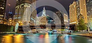 Reflections of Chicago River Canal at Night with Surrounding Skyscrapers