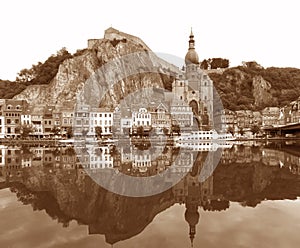 Reflections of the the Citadel and the Collegiate Church of Our Lady on the Meuse River, Dinant, Belgium