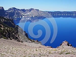 Reflections in deep blue Crater Lake