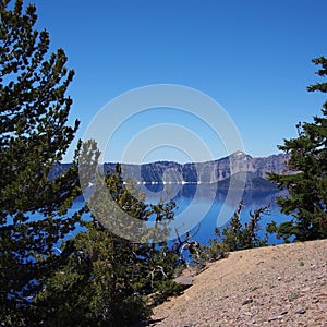 Reflections in deep blue Crater Lake