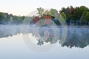 Reflections of Fall Colors on a Tranquil Lake