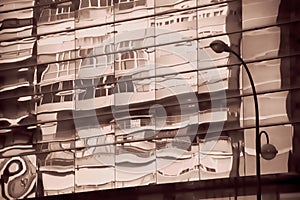 Reflections on a glass in a commercial area of Seville 12