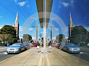 Reflections of glass windows in Melbourne streets and shops