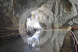 Reflections in the Great Hall of the Scarisoara cave, Romania.