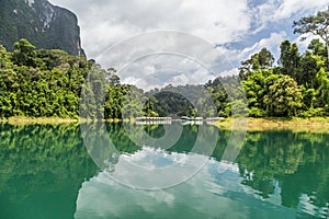 Reflections of houseboat in the dam