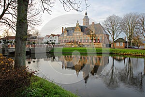Reflections of Kloveniersdoelen, an old Renaissance building in Middelburg