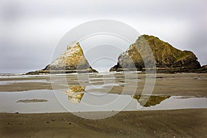 Reflections of the monoliths at Heceta Head State park