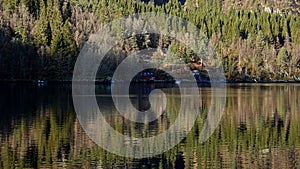 Reflections in Mostraumen strait in Osterfjord near Bergen in Norway in Autumn