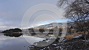 First snow at Vangmjose lake near Vang in autumn in Norway