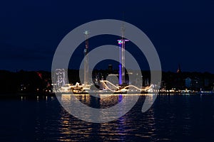 Reflections at night of the amusement park Gröna Lund, Stockholm, Sweden