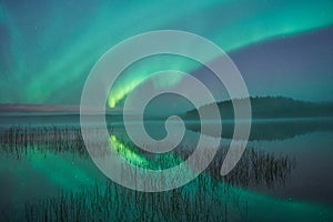 Reflections of northern lights in Swedish lake