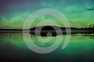 Reflections of northern lights in Swedish lake