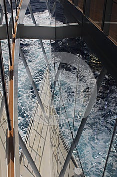 Reflections of the sea through the promenade deck of the cruise ship Iona