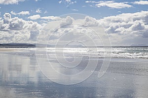 Reflections of the sky at Pakiri Beach Northland New Zealand NZ