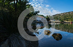 Reflections of a small bay photo