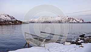 Reflections of snow covered mountains near Svolvaer on the Lofoten in Norway