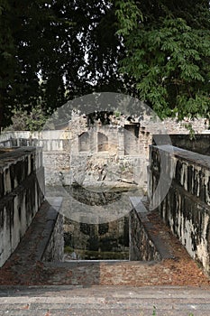 Reflections in Step Well, Qutb or Qutub Shahi Tombs, Ibrahim Bagh, Hyderabad, Telangana, India