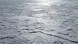 Reflections of sunlight on melt-freeze ice crust