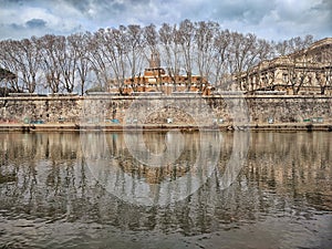 Reflections on the Tevere river, Rome Italy