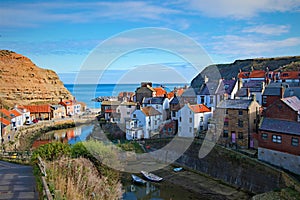 Reflections towards the harbour in Staithes, in North Yorkshire.