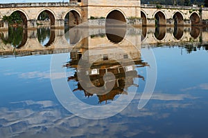 Reflections in the water. Old chinese bridge. The ancient Shuanglong Bridge Seventeen Span Bridge Jianshui, Yunnan, China