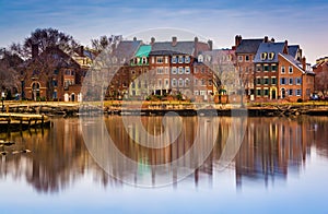 Reflections of waterfront buildings along the Potomac River in A