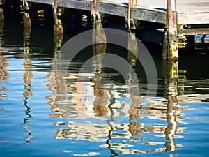 Reflections of wooden posts at Baltimore Harbor