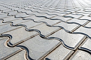 Reflective interlocking tiles with curves