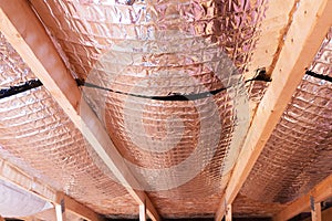 Reflective Radiant Heat Barriers Between Attic Joists Used as Ba