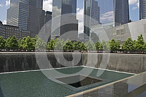 Ground Zero 9/11 Memorial North Pool with skyscraper Freedom Tower