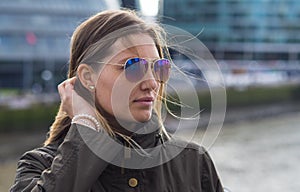 Reflective woman in the city of London