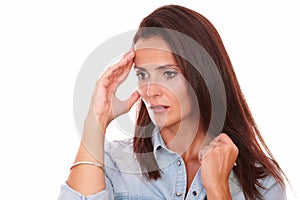 Reflective young woman with headache looking down