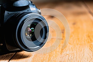 Reflex camera or dslr with reflexion on lens, photograph equipment, for professionnal and agency