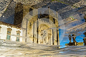 Reflexion of the catholic church in puddle