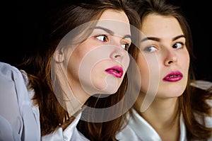 Reflexion girl looking in mirror. Appearance concept. Beauty treatment and skin care concept. Woman makeup face pink