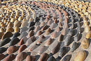 Reflexology cobblestones pathway for foot massage. Pattern from convex pebble stones. Textured surface from boulders