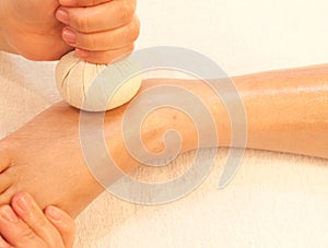 Reflexology foot massage by ball herb