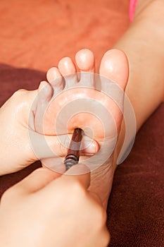 Reflexology foot massage, spa foot treatment
