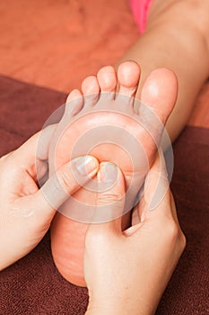 Reflexology foot massage, spa foot treatment