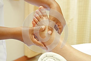 Reflexology foot massage, spa foot treatment