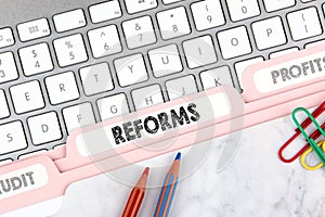 Reforms concept. Folder Register on Background of Computer Keyboard