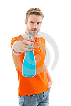 Refresh right now. Man hold mist sprayer like weapon aiming you. On his target. Refreshing shot. Man handsome guy