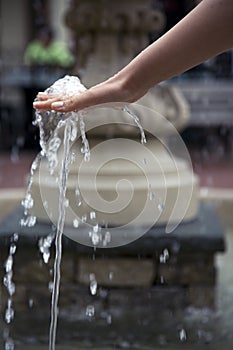 Refreshed hand at a water fountain