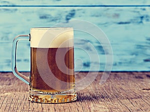Refreshing beer served in a glass mug