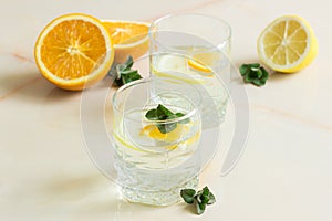 Refreshing birch juice with mint sliced lemon and orange