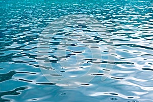 refreshing blue swimming pool water as a background.