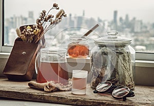 Refreshing with Chinese herbal tea Jub Lieng served with honey on old wooden table with city view